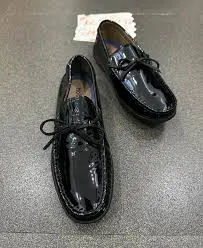black patent leather slip-on loafers with laces